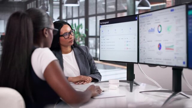 Two Young Women Using Computer