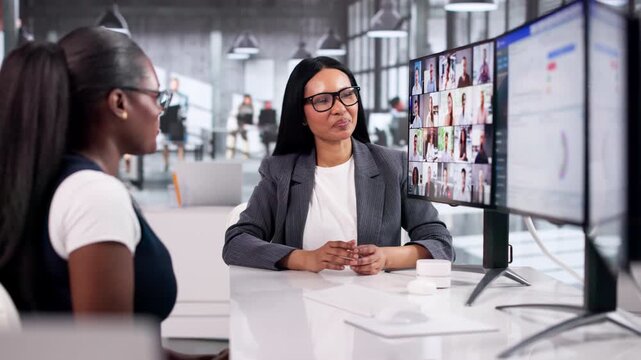 Two Women Discussing KPI Indicators