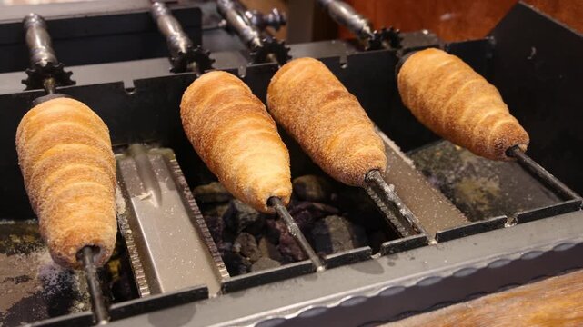 Chimney Cakes Being Cooked ove Hot Coals in Prague, Czech Republic.
