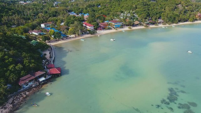Drone View Koh Tao Beachfront Colorful Roofs And Calm Shallows, Palm Fringe, Beach Access And Small Piers