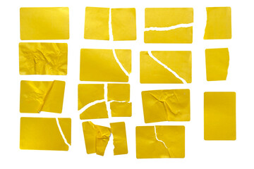 A set of torn golden yellow sticky notes isolated on a white background. A collection of crumpled and torn sticky paper pieces for creative design layouts and reminders. © DRBURHAN