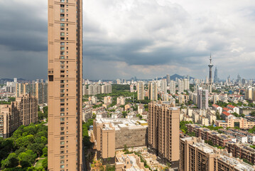 Residential high rises and Nanjing skyline under dramatic clouds © C