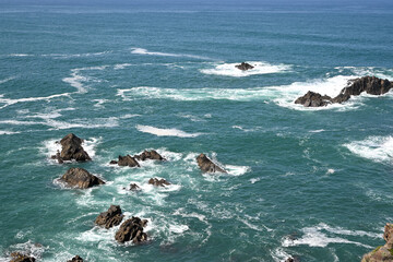Crashing Waves and Dark Sea Stacks in the Atlantic Ocean off the Portuguese Coast © Lucie