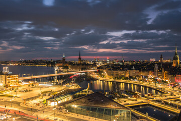 Fototapeta premium Stockholm Sweden Skyline with City Hall Stadshuset and Riddarholmen Church at Sunset with Bridges and Waterfront Cityscape
