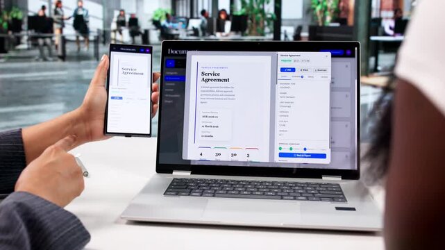 Two Women Using Laptop And Smartphone