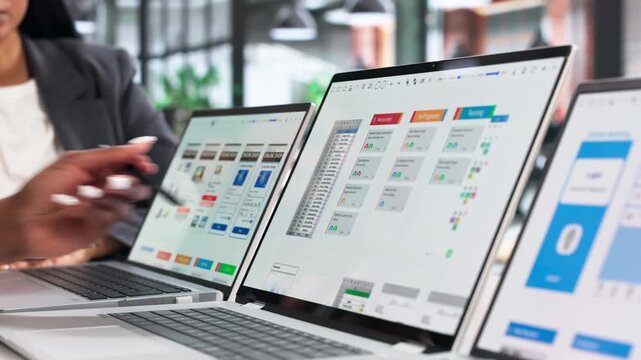 Women Collaborate On Laptop Designing Simple App Interface