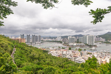 Elevated view of Sanya marina and coastal skyline with boats and high rise buildings, Hainan, China © C