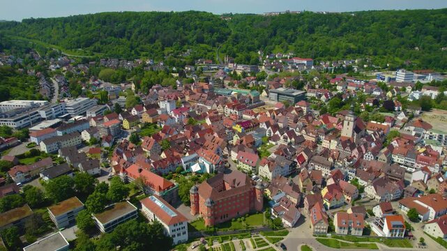 An panoramic aerial view from the city and castle K&uuml;nzelsau in Germany on a sunny spring noon.