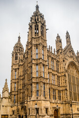 Obraz premium Historic Gothic Revival Government Architecture with Ornate Stone Facade Towers and Grand Arched Entrance Details