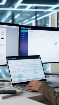 Risk Manager Carefully Analyzes Data On Laptop
