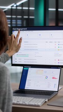 Risk Manager Analyzing Corporate Data On Laptop