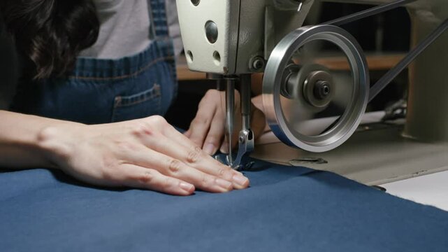 work accident woman hand get caught in sewing machine