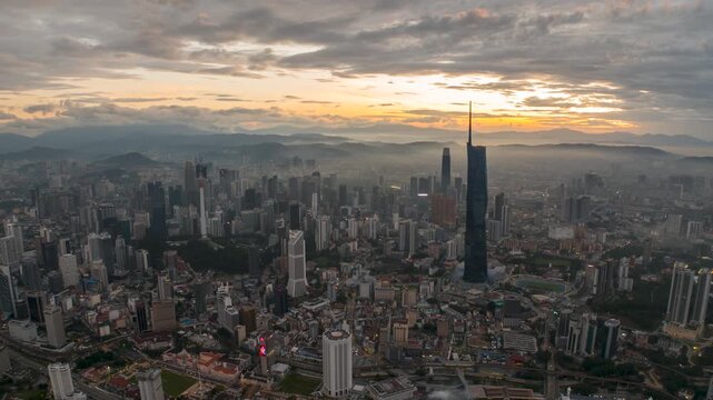 Aerial view time lapse 4k video of Kuala Lumpur city center view during dawn overlooking the city skyline in Federal Territory, Malaysia. 