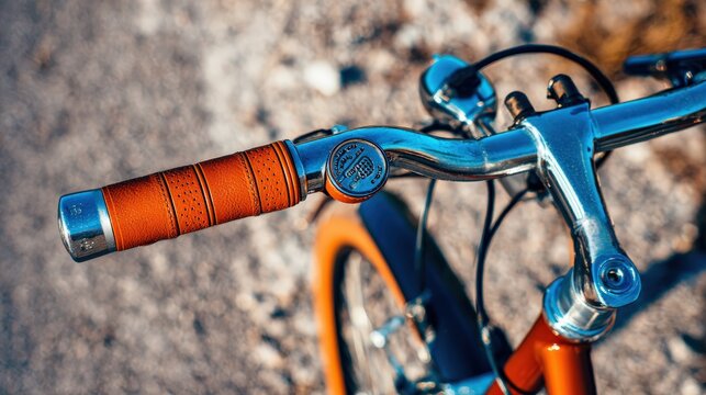 Close up view of bicycle handlebars featuring stylish grip and shiny chrome components