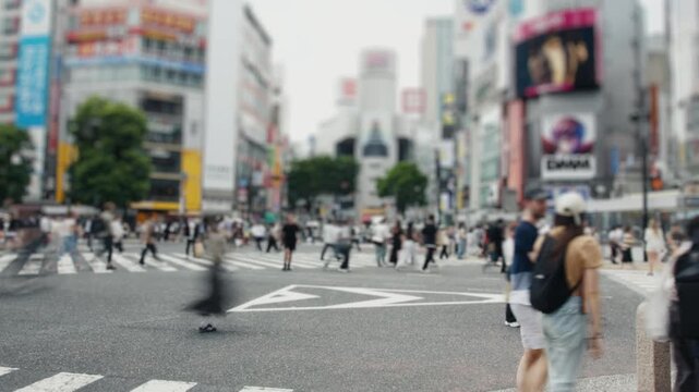 People crossing the famous shibuya scramble intersection in tokyo