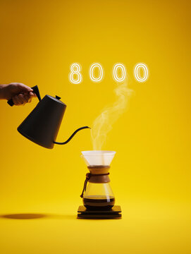 Hand Pouring Hot Water from Black Gooseneck Kettle into Glass Pour Over Coffee Maker with Neon 8000 Sign on Yellow Background
