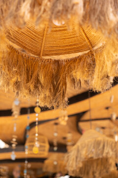 Artisanal Boho Tiki Pendant Light in Luxury Tropical Resort Interior with Copy Space