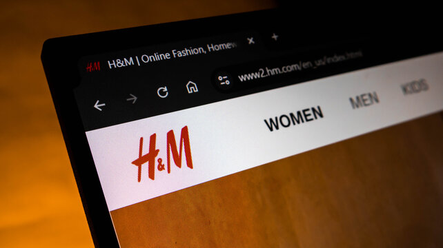 Closeup of the hm website homepage displayed on a laptop screen