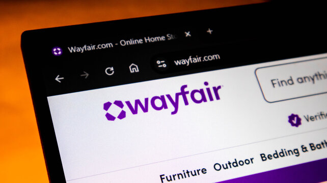 Closeup of the wayfair website homepage displayed on a computer screen, showing the logo and navigation menu for the online home goods retailer