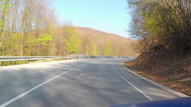 Downhill early spring ride video on mountain pass Pezinska Baba in low mountain range Little Carpathians mountain, western Slovakia. Some first leaves on mostly beech and oak trees around visible.