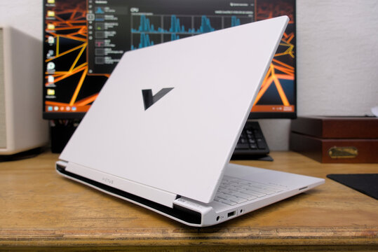 Zapopan Jalisco, Mexico - May 8, 2026: White hp victus gaming laptop on wooden desk, technology concept