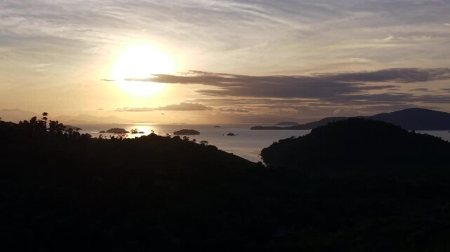 Sunset Over Ocean with Bright Sun Reflection