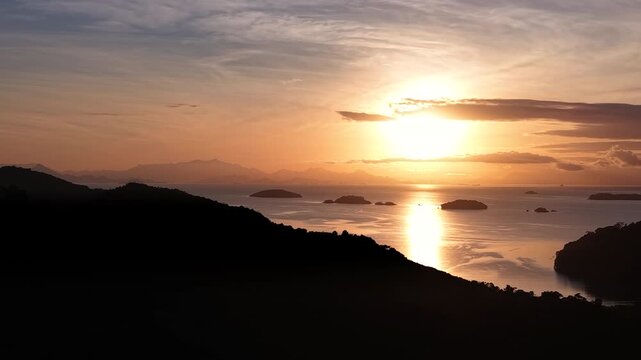 Golden Coast Sunset with Island Silhouettes