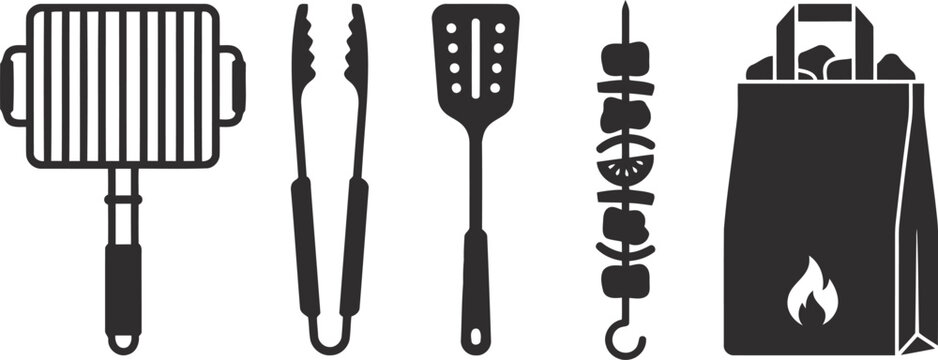 Black barbecue grill and cooking utensils