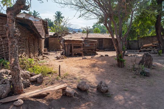 wattle and daub houses and shed surrounding village gathering space in mto wa mbu tanzania africa