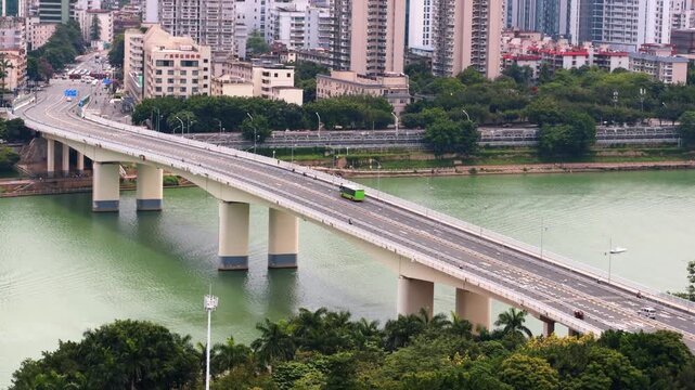The Yongjiang River Bridge and high-rise buildings along the riverbank in Nanning, Guangxi, China.