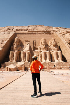 Adventurous traveler exploring the ancient Abu Simbel temples in southern Egypt