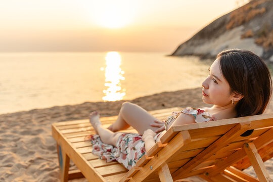 Woman in dress on the beach.