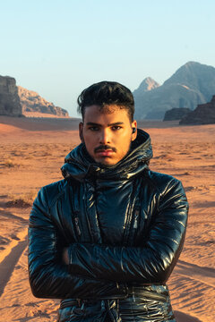 Solitary explorer in a rugged desert landscape