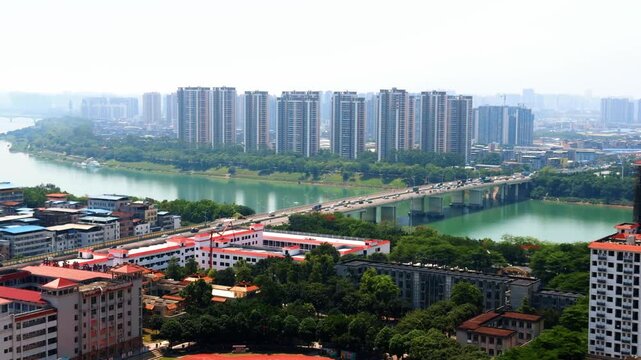 The Yongjiang River Bridge and high-rise buildings along the riverbank in Nanning, Guangxi, China.