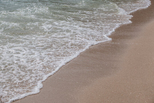 Sea blue wave with sand beach at coast vacation holidays tropical.
