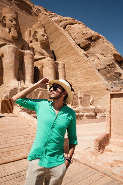 Young male traveler exploring the Great Temple of Abu Simbel in Egypt