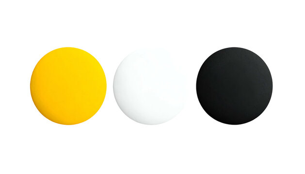 Three colored, solid matte spheres aligned horizontally