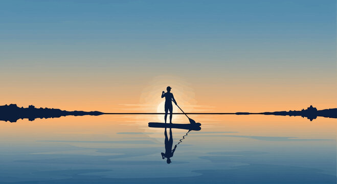 Silhouette of a person paddleboarding on calm water at sunset
