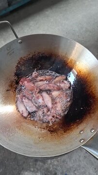 Vertical Full HD close up Authentic Thai Street Food: Frying Dried Squid
