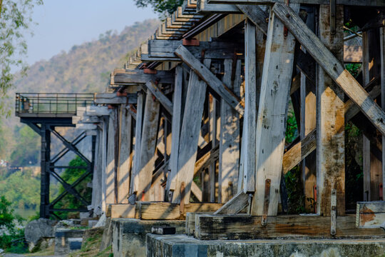 photograph captures the historic Death Railway at the Tham Krasae Bridge section in Kanchanaburi, Thailand. 