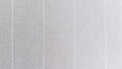 Fototapeta premium Light gray fabric texture background with vertical stripe pattern and soft woven details, ideal for wallpaper, interior design, and modern backdrop concepts.