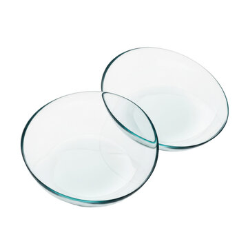 Two clear hydrogel contact lenses with subtle teal edges overlapping on transparent background with wet reflections, clinical vision technology atmosphere