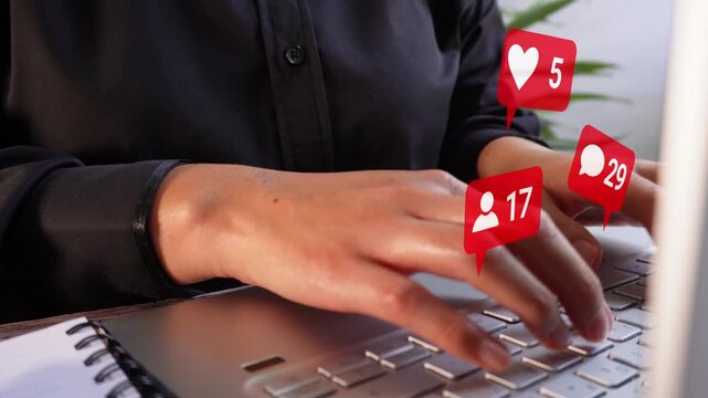 Close-up of a businesswoman working on her computer with an animated notification of incoming messages or emails, and a counter.
