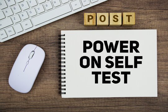 POST Power On Self Test message with keyboard and optical mouse on wooden background