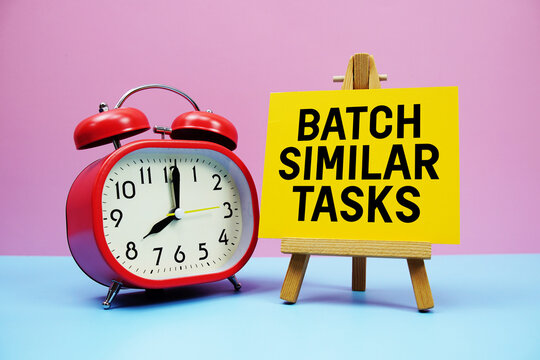 Batch Similar Tasks text with alarm clock on pink and blue background