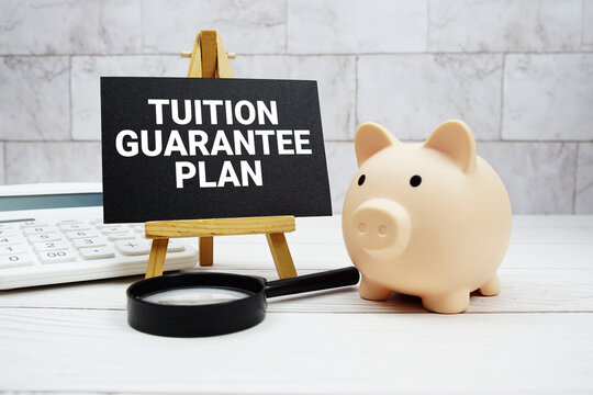 Tuition Guarantee Plan text  with piggy bank, calculator and magnifying glass