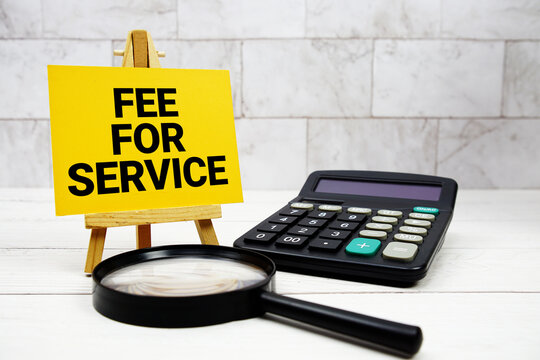 Fee For Service text with calculator and magnifying glass
