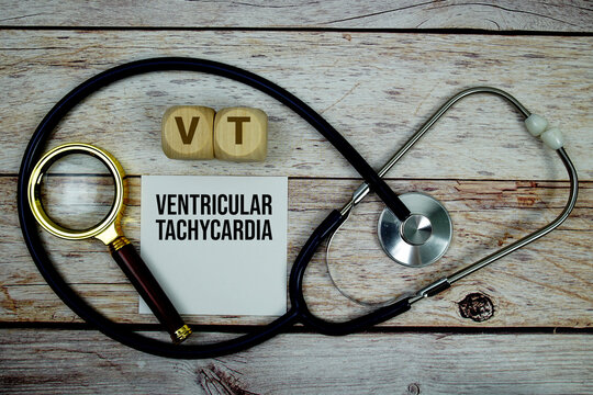 Ventricular Tachycardia (VT) text with stethoscope and magnifying glass on wooden background