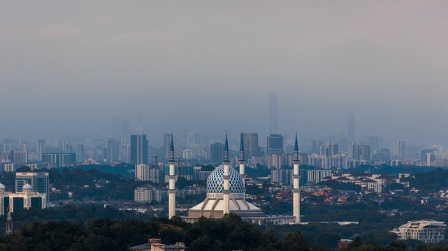 Time Lapse of Sultan Salahuddin Abdul Aziz Shah Mosque in Shah Alam at Sunset with Magenta Sky and Moving Clouds, Selangor, Malaysia