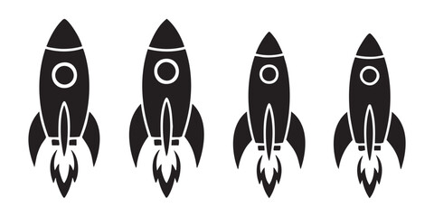 Rocket launch silhouette collection with four different styles of spacecraft and exhaust fire icons. © Mohammad